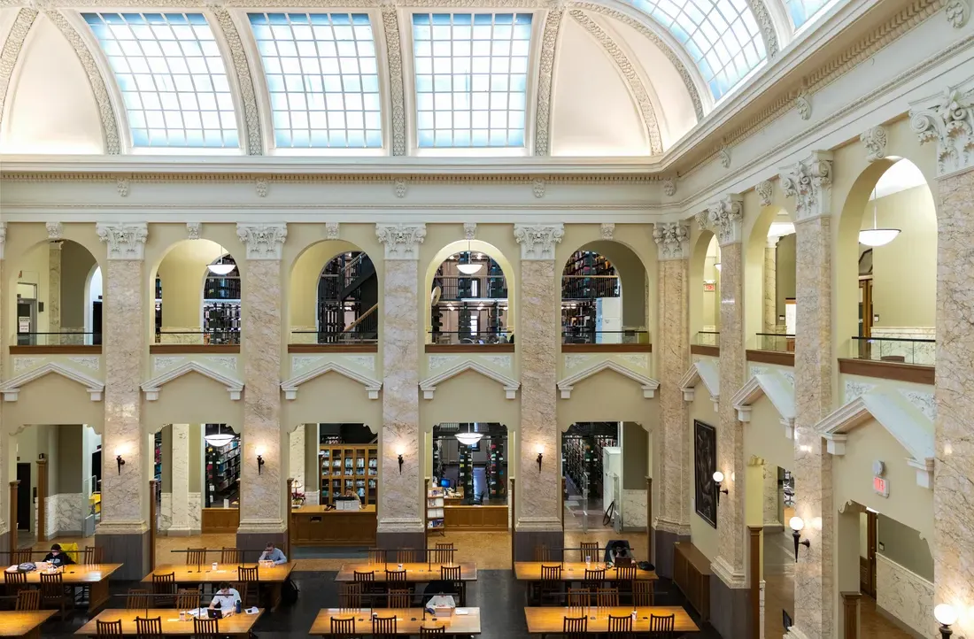 View of interior of a library with large, open central area