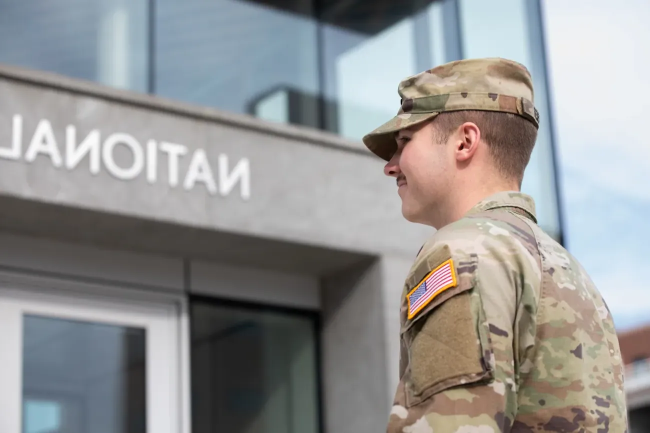 Military affiliated student smiling.